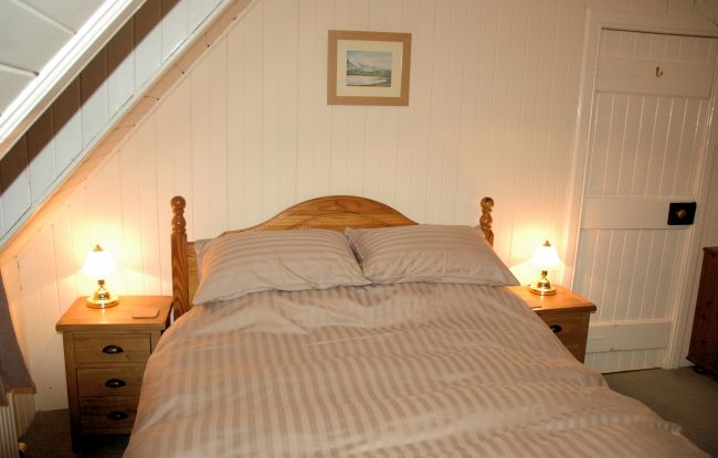 The bedrooms in Bruaich Cottage have pine-lined walls and ceilings and are cosy and welcoming. There are superb views from the bedroom windows.